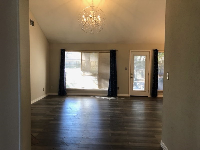 19707 Auburn Park Lane Spring, TX 77379 - Photo 2 of 16 a view of an empty room with wooden floor and a window