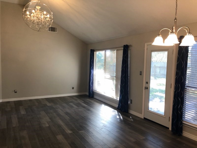 19707 Auburn Park Lane Spring, TX 77379 - Photo 4 of 16 an empty room with wooden floor and windows
