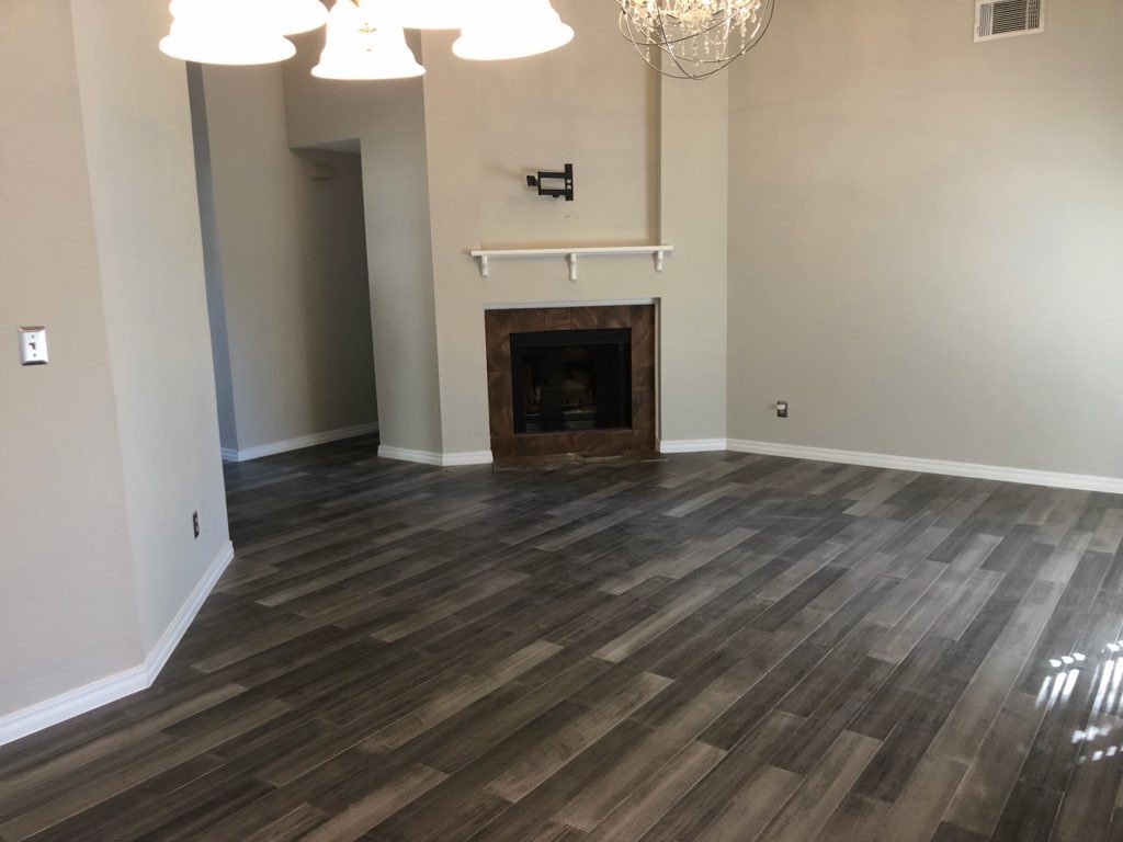 19707 Auburn Park Lane Spring, TX 77379 - Photo 5 of 16 a view of a livingroom with wooden floor and a fireplace