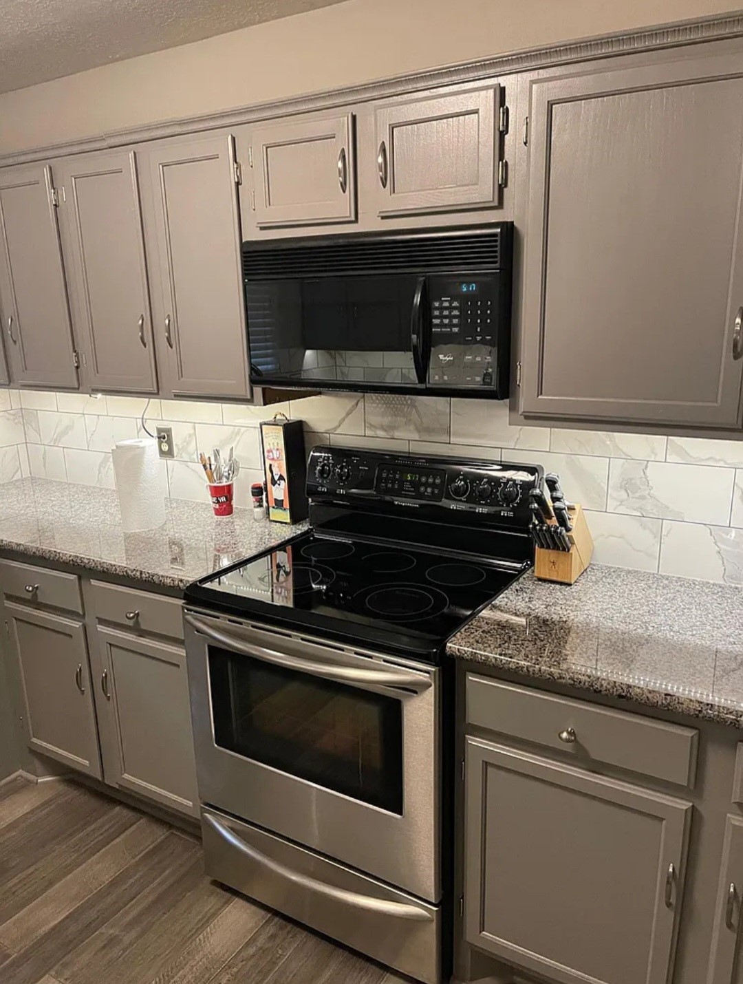 19707 Auburn Park Lane Spring, TX 77379 - Photo 10 of 16 a kitchen with granite countertop a stove microwave and sink