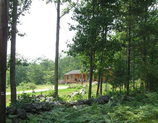 38 Perry Hill Road Harrison, ME 04040 - Photo 3 of 21 Exterior Front. Rustic stone walls...