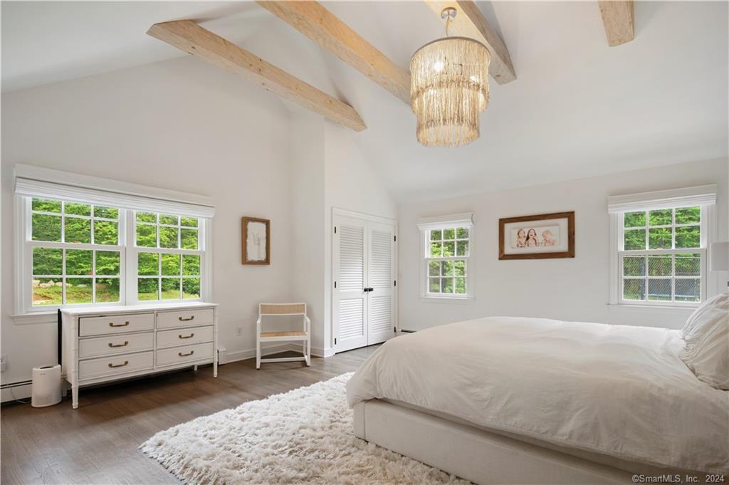 782 Smith Ridge Road New Canaan, CT 06840 - Photo 19 of 28 a bedroom with a bed and a window