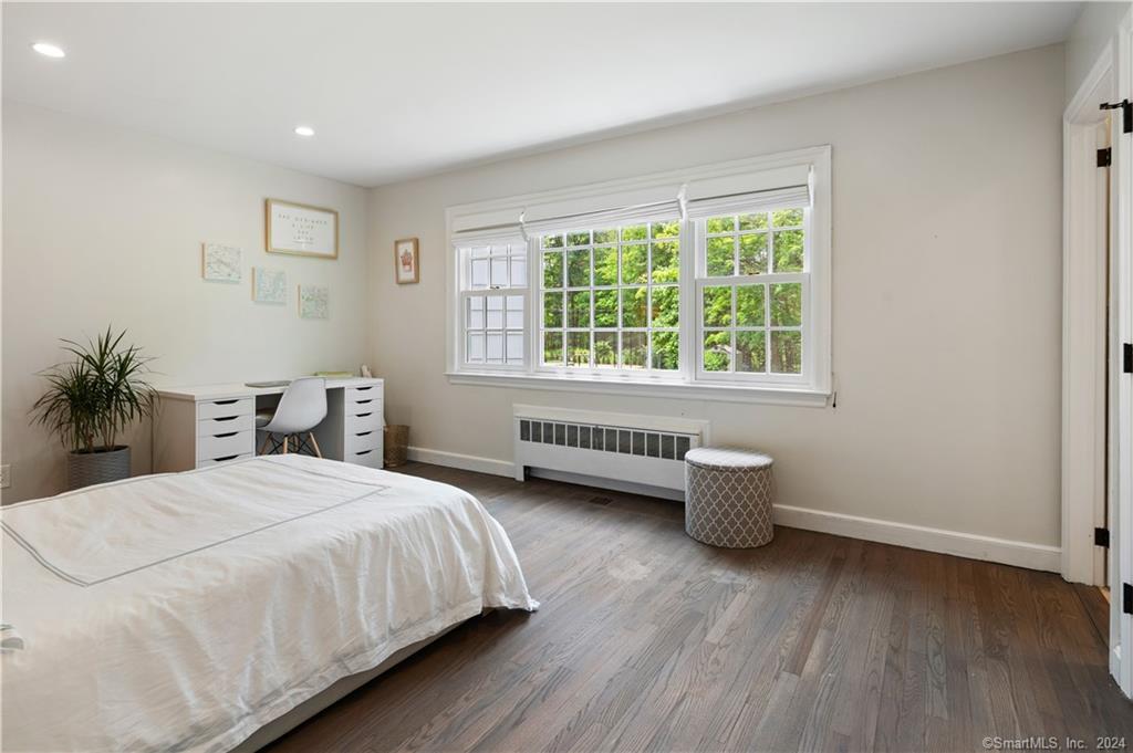782 Smith Ridge Road New Canaan, CT 06840 - Photo 22 of 28 a bedroom with a bed and a window