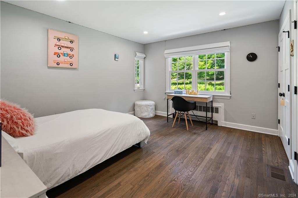 782 Smith Ridge Road New Canaan, CT 06840 - Photo 23 of 28 a bedroom with a bed and a window