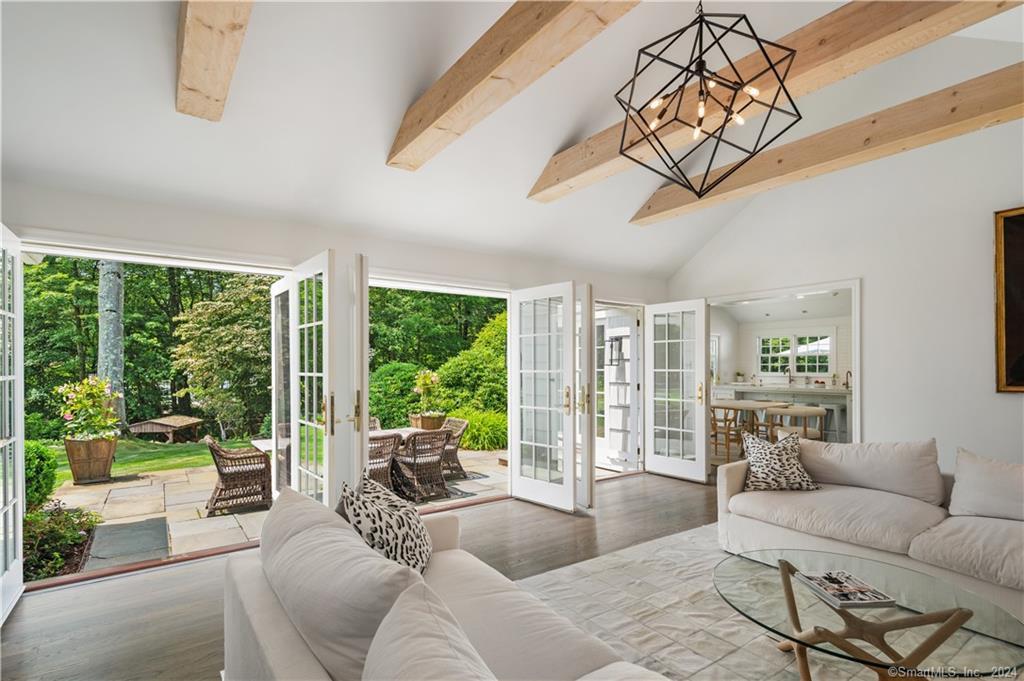 782 Smith Ridge Road New Canaan, CT 06840 - Photo 8 of 28 a living room with furniture and a large window