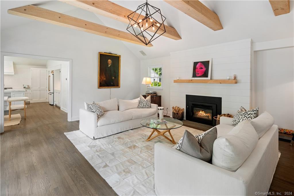 782 Smith Ridge Road New Canaan, CT 06840 - Photo 9 of 28 a living room with furniture and a fireplace
