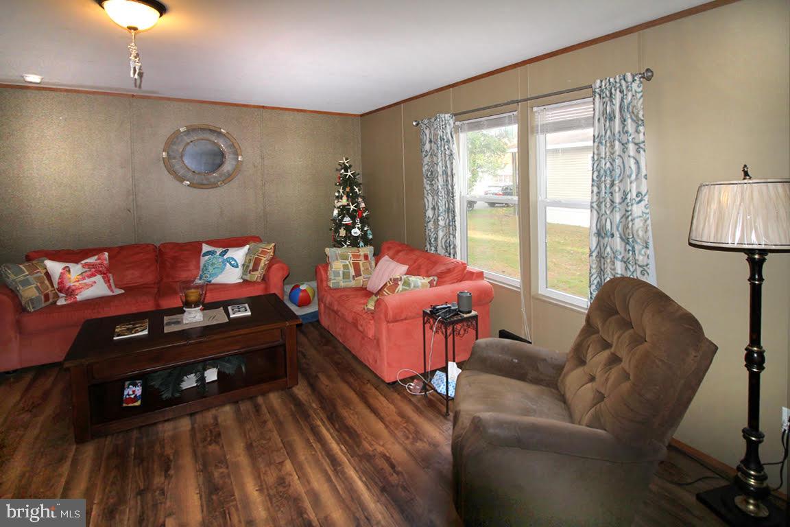 29590 Maple Road, Unit 55141 Lewes, DE 19958 - Photo 6 of 12 Sideview of Livingroom