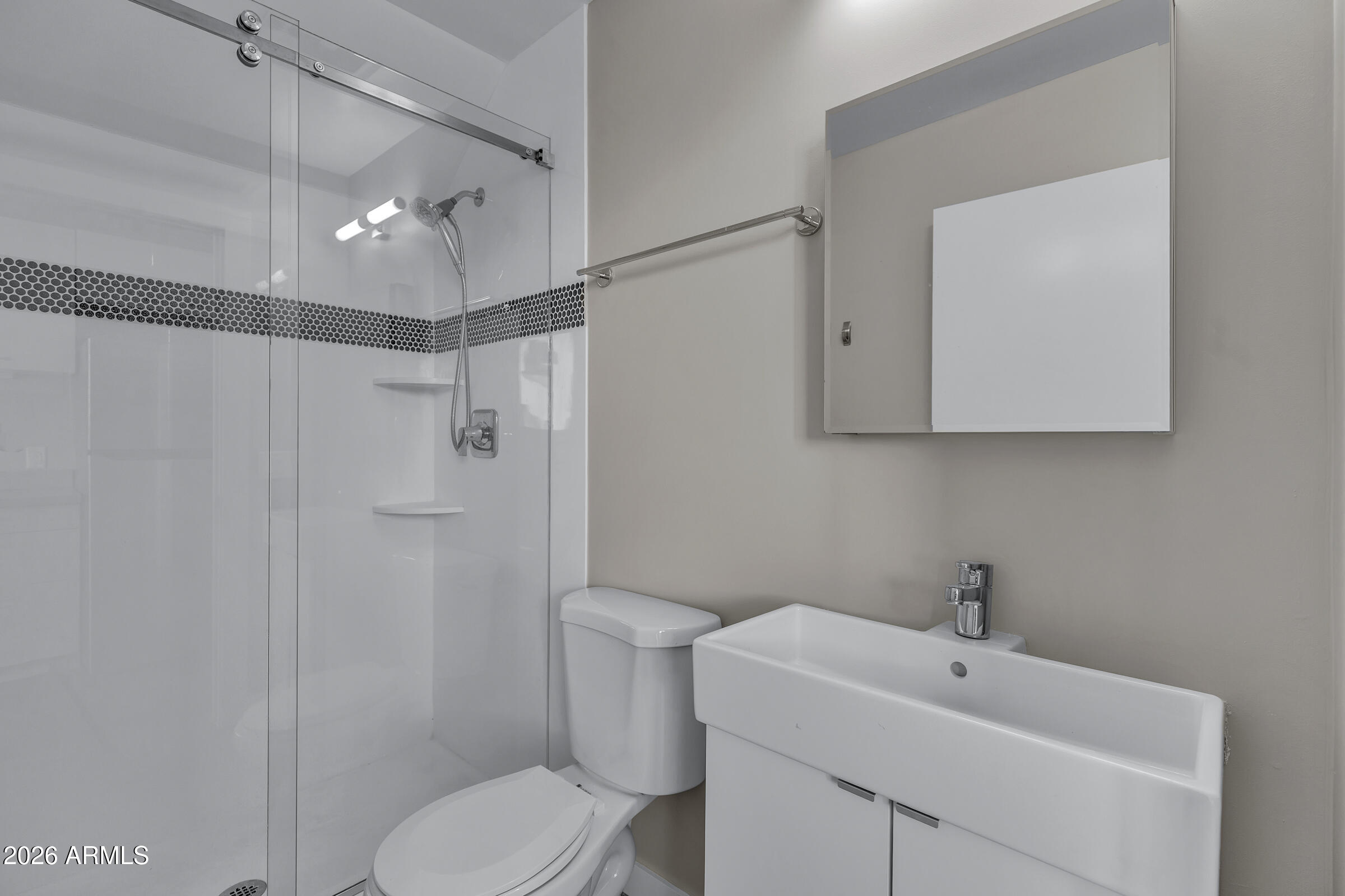 1491 South Rita Lane Tempe, AZ 85281 - Photo 12 of 15 a bathroom with a sink toilet and shower