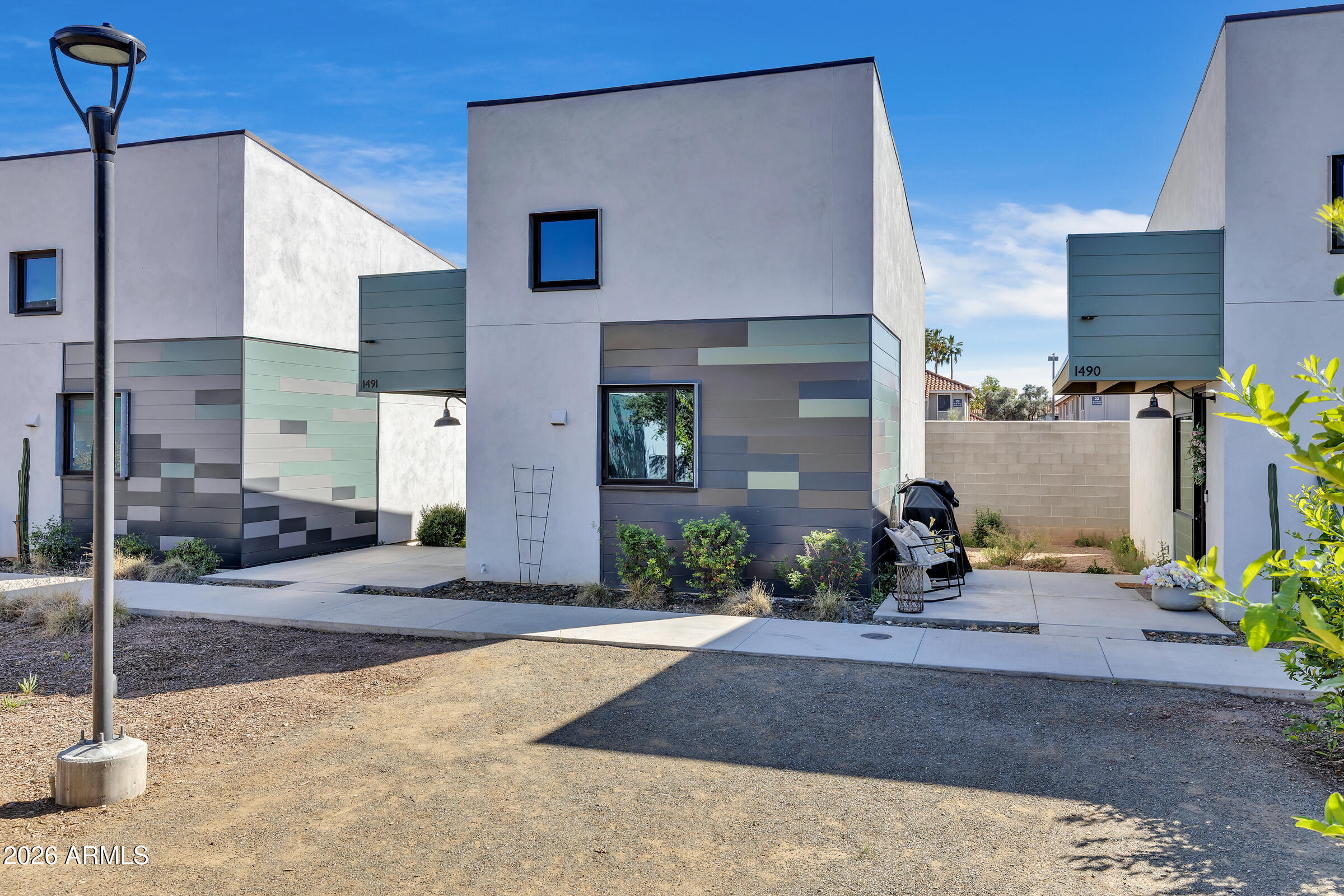 1491 South Rita Lane Tempe, AZ 85281 - Photo 2 of 15 a front view of a building with sitting area