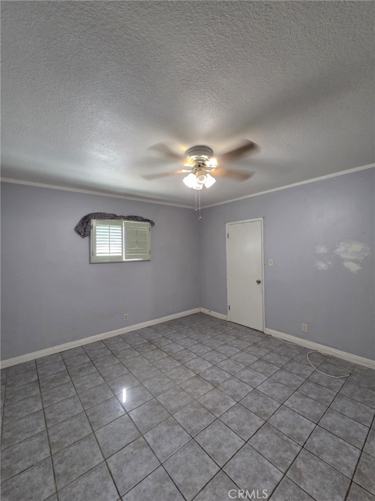 7072 Kermore Lane Stanton, CA 90680 - Photo 12 of 24 a view of an empty room with a window