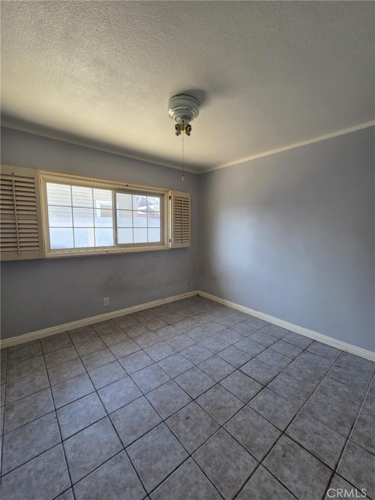 7072 Kermore Lane Stanton, CA 90680 - Photo 13 of 24 an empty room with windows