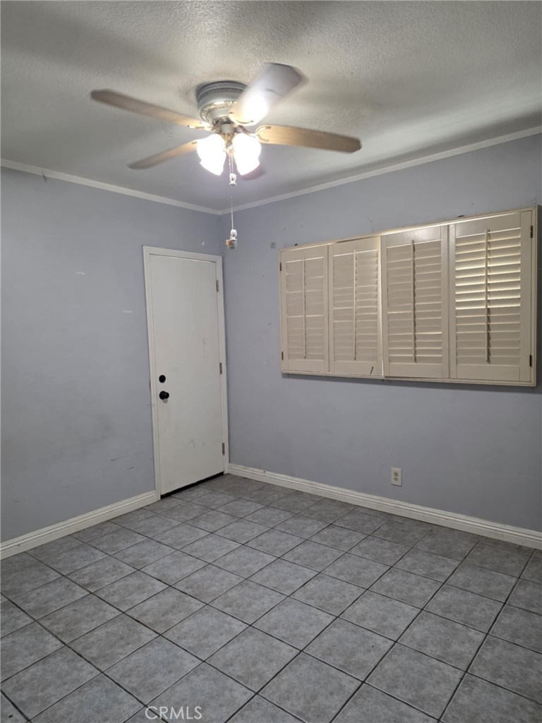 7072 Kermore Lane Stanton, CA 90680 - Photo 14 of 24 a view of an empty room with a window