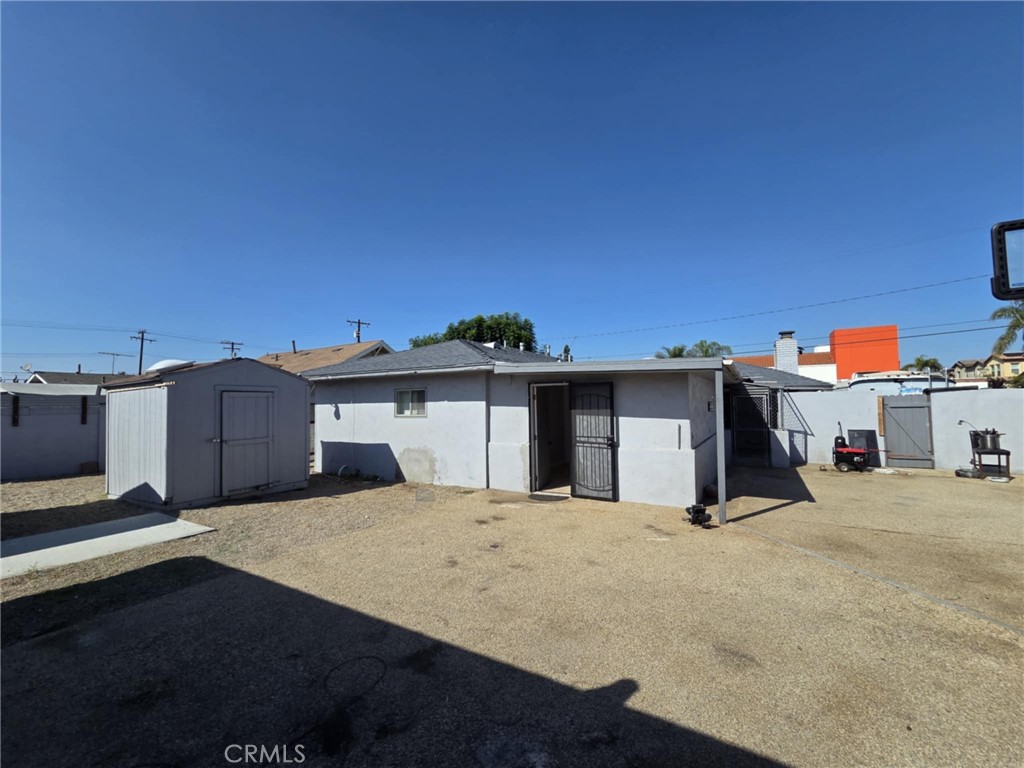 7072 Kermore Lane Stanton, CA 90680 - Photo 15 of 24 a view of a house with a backyard