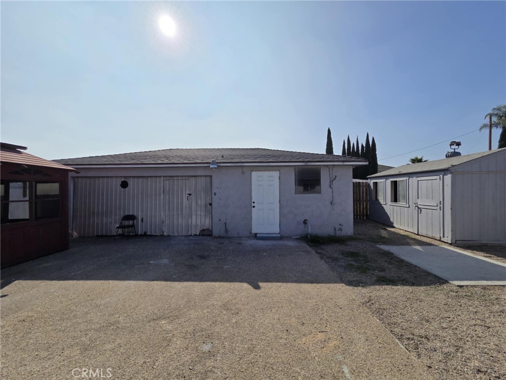 7072 Kermore Lane Stanton, CA 90680 - Photo 16 of 24 a front view of a house with a garage