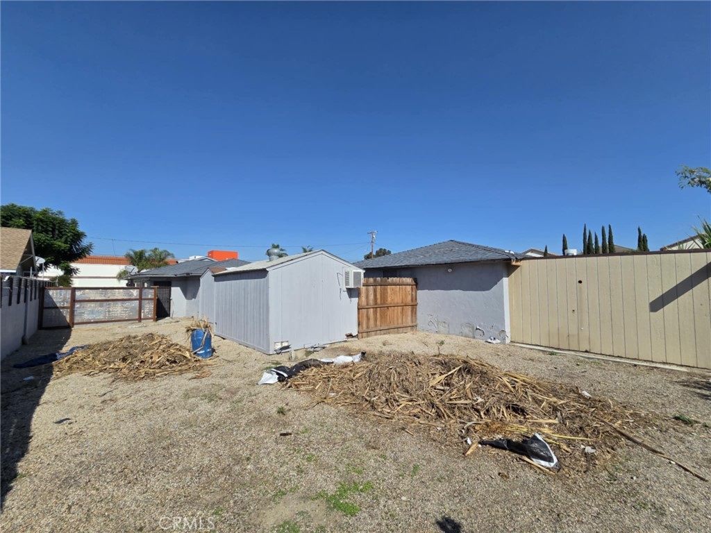 7072 Kermore Lane Stanton, CA 90680 - Photo 23 of 24 a view of a house with a wooden fence