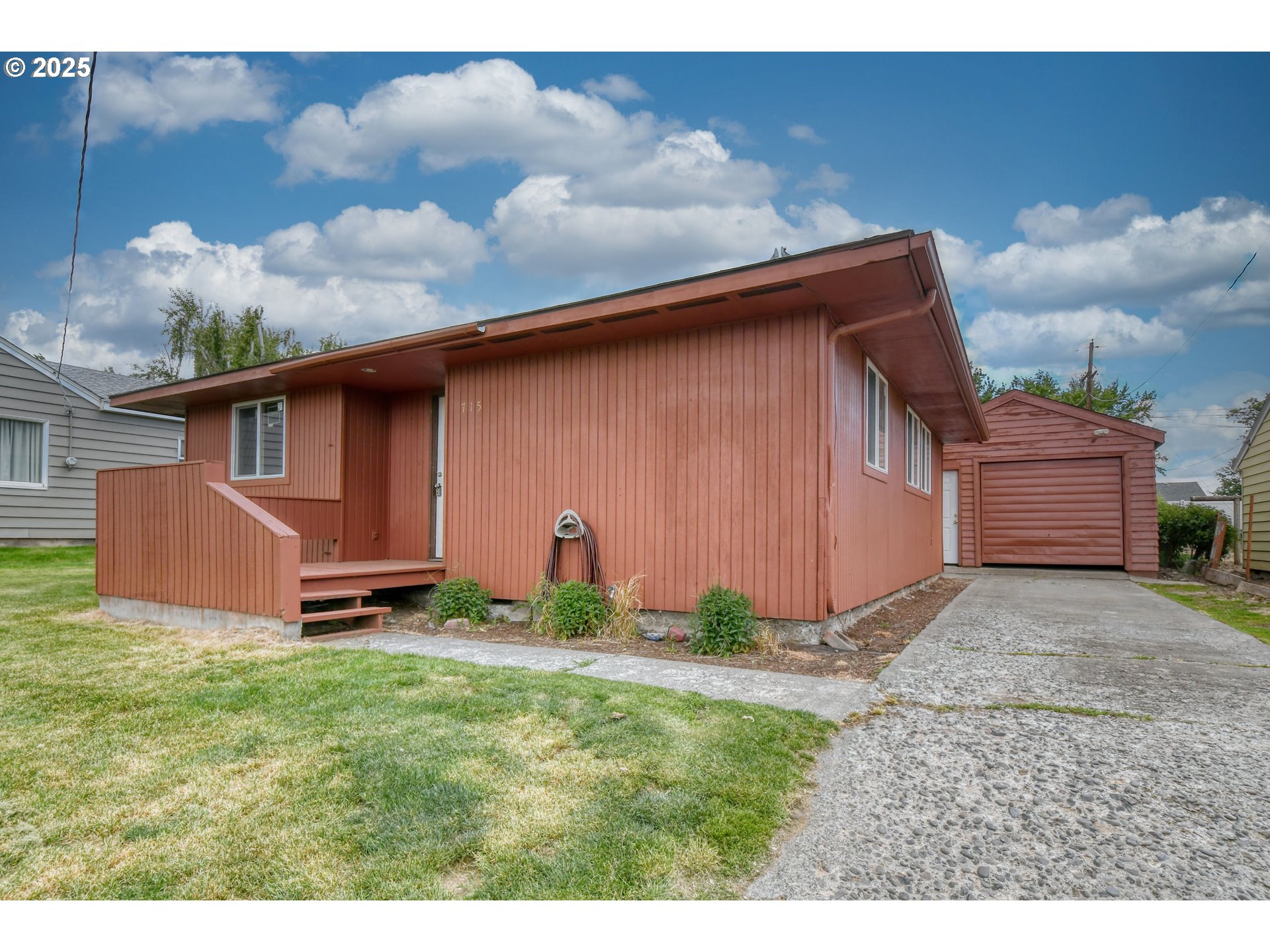 715 Southwest 28th Street Pendleton, OR 97801 - Photo 1 of 38 a backyard of a house with table and chairs