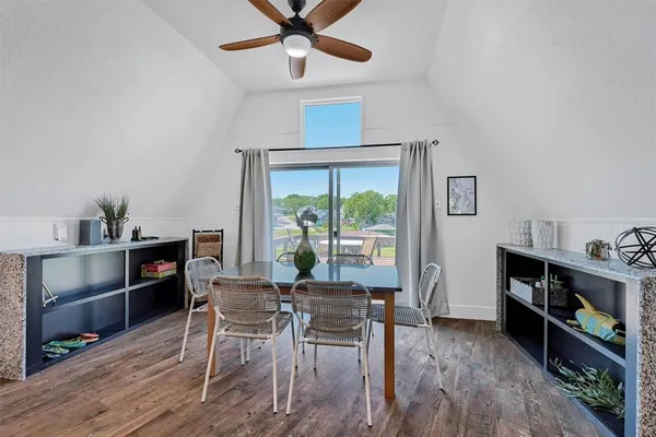 a dining room with furniture and window