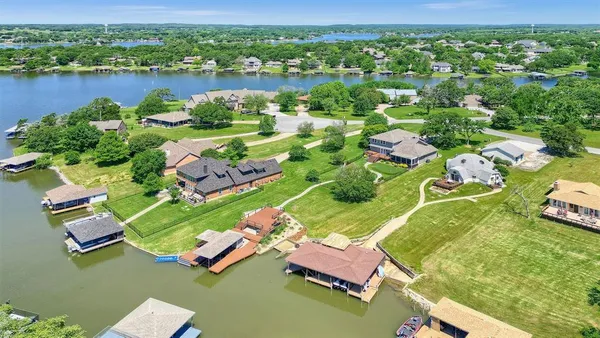 an aerial view of a house with a lake view
