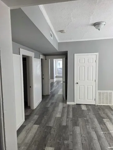 an empty room with entrance door