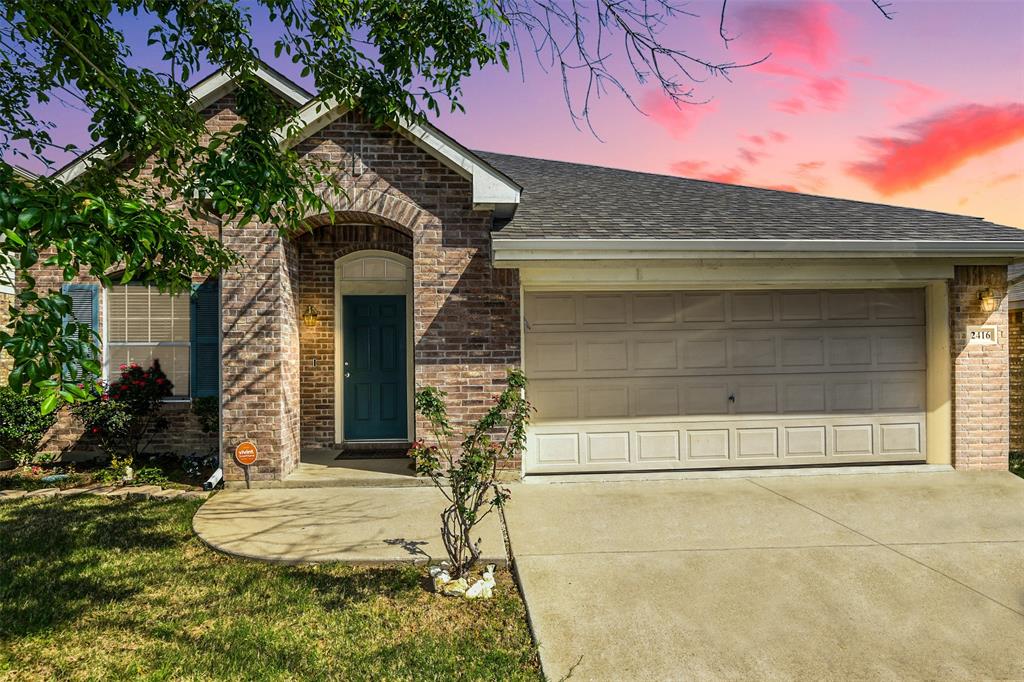 2416 Poplar Spring Road Fort Worth, TX 76123 - Photo 1 of 1 a front view of a house with a yard