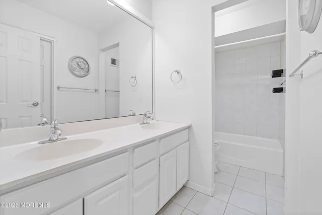 a view of a house with a yard and a garden