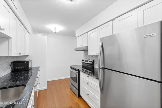 a view of a balcony with wooden floor