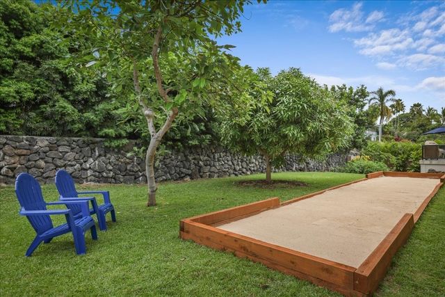 a view of a golf course with chairs