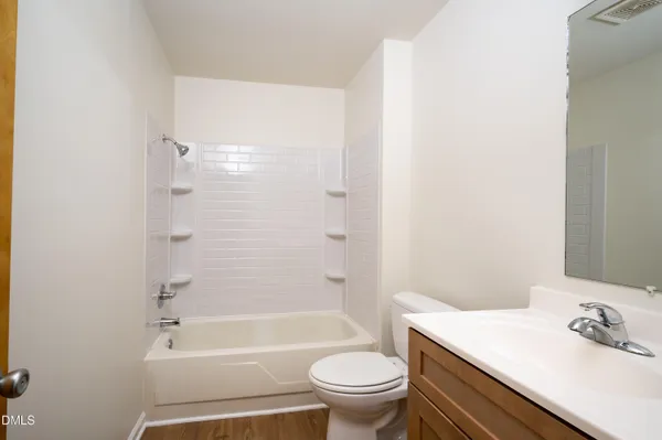 a bathroom with a sink toilet and bathtub