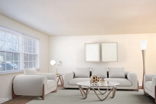 a living room with furniture and windows