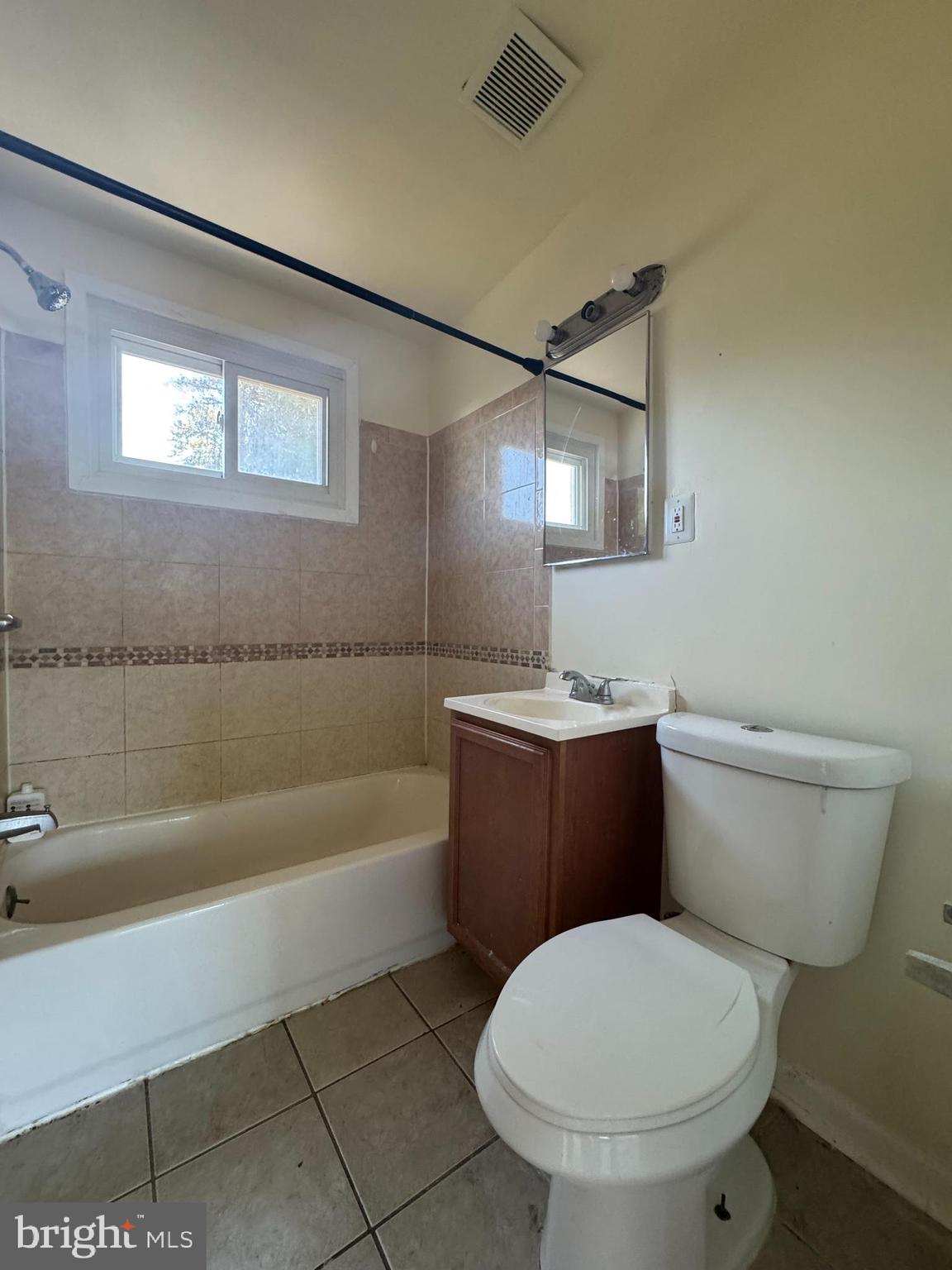 1015 Quebec Terrace Silver Spring, MD 20903 - Photo 12 of 13 a bathroom with a toilet a sink and bathtub