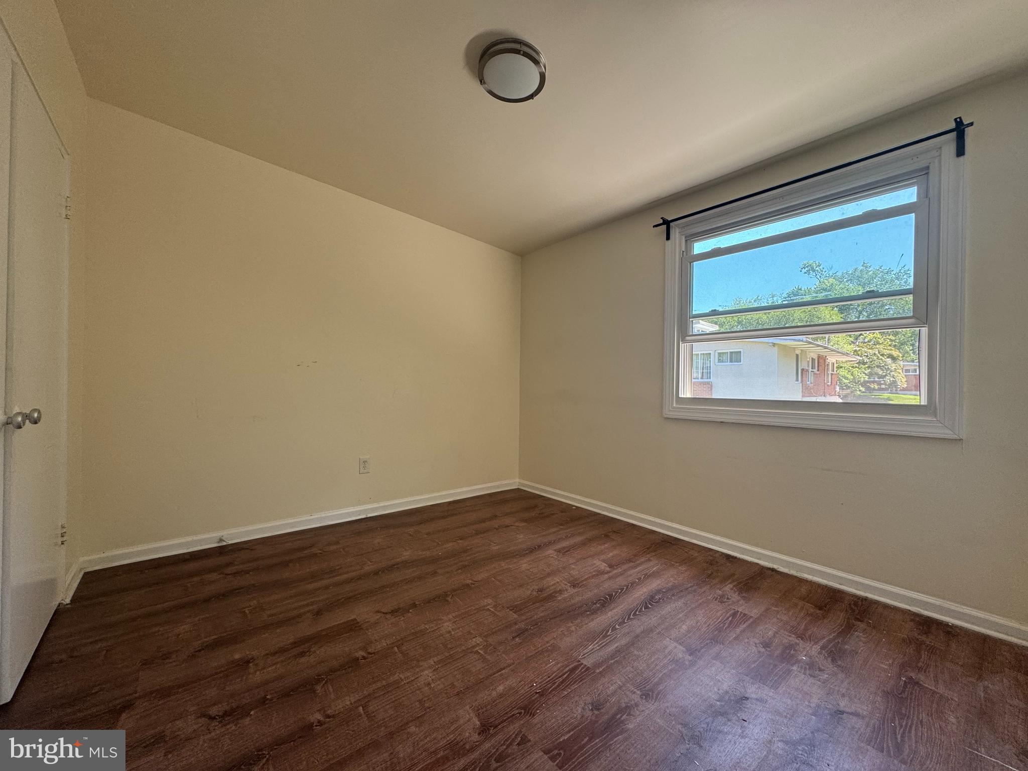 1015 Quebec Terrace Silver Spring, MD 20903 - Photo 13 of 13 an empty room with a window