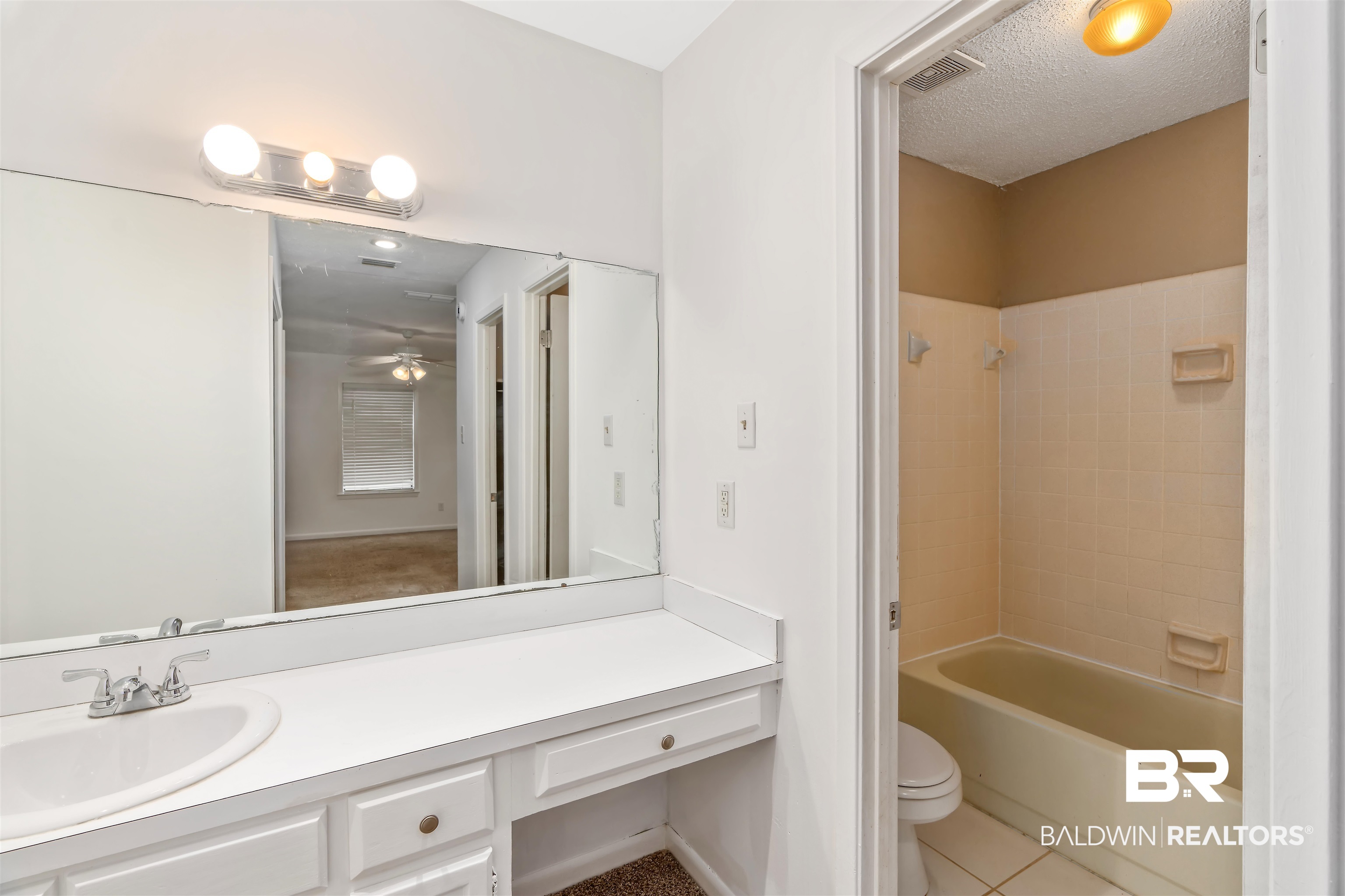 159 Montclair Loop Daphne, AL 36526 - Photo 10 of 18 Full bath featuring shower combination, vanity, light tile patterned floors, a textured ceiling, and ceiling fan