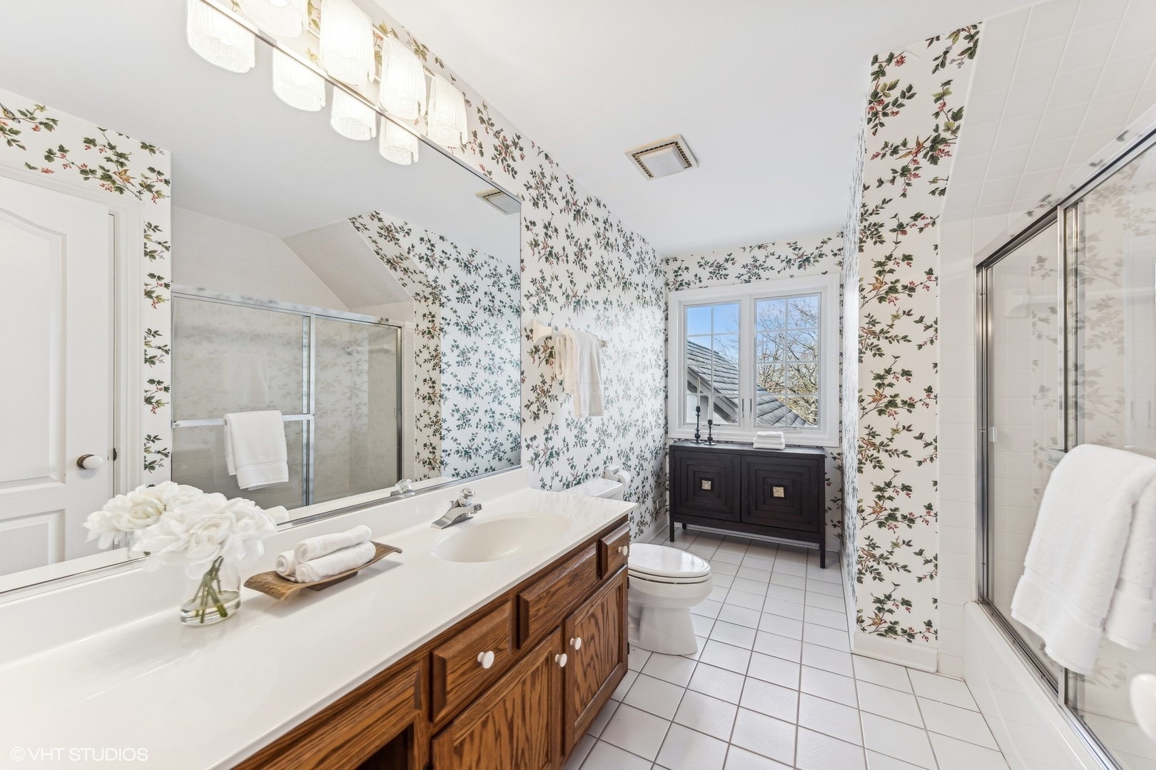 16 Lake Ridge Club Court Burr Ridge, IL 60527 - Photo 17 of 26 a spacious bathroom with a double vanity sink mirror and shower