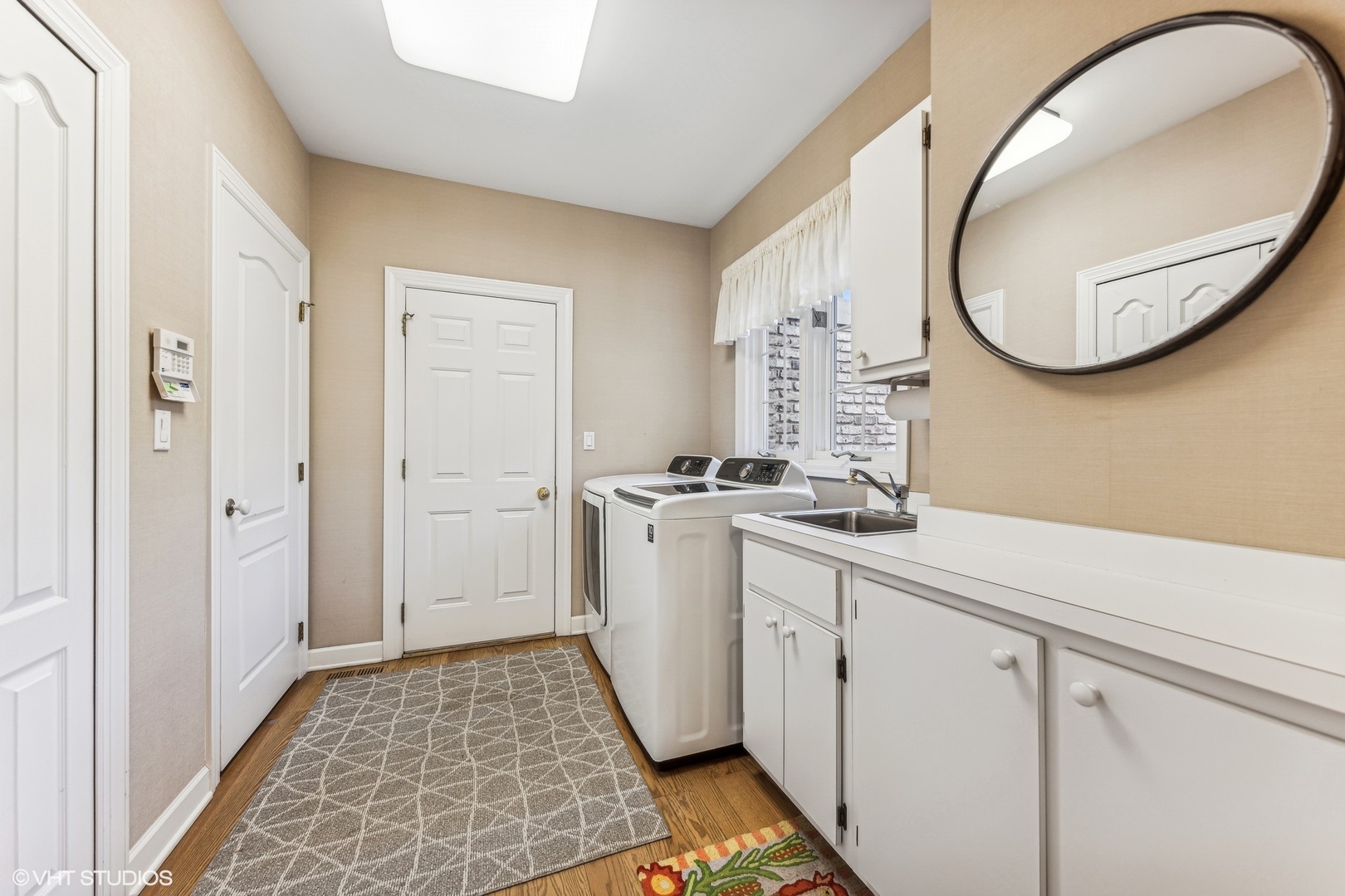 16 Lake Ridge Club Court Burr Ridge, IL 60527 - Photo 18 of 26 a bathroom with a sink and a mirror