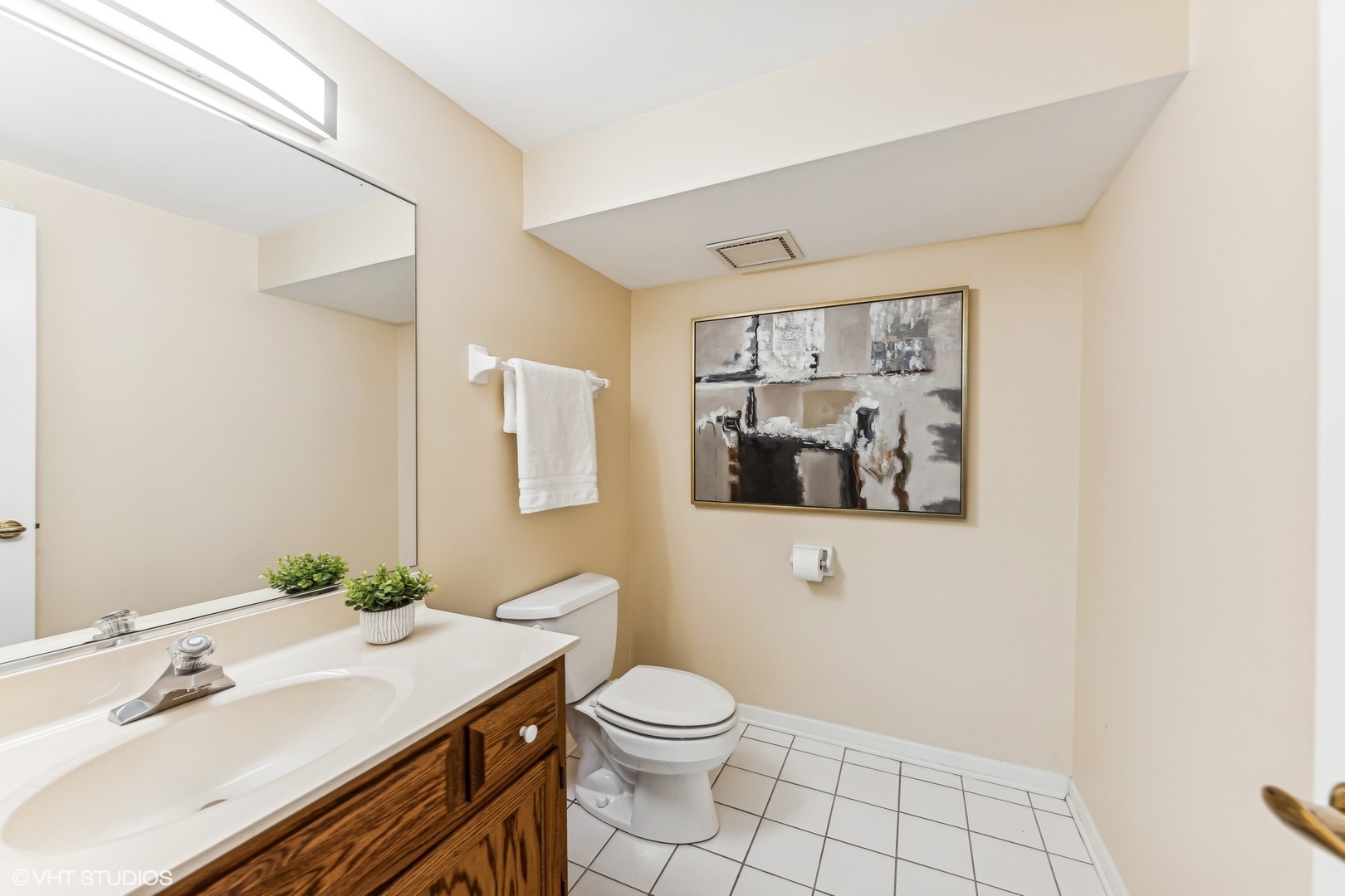 16 Lake Ridge Club Court Burr Ridge, IL 60527 - Photo 21 of 26 a bathroom with a granite countertop sink mirror and toilet