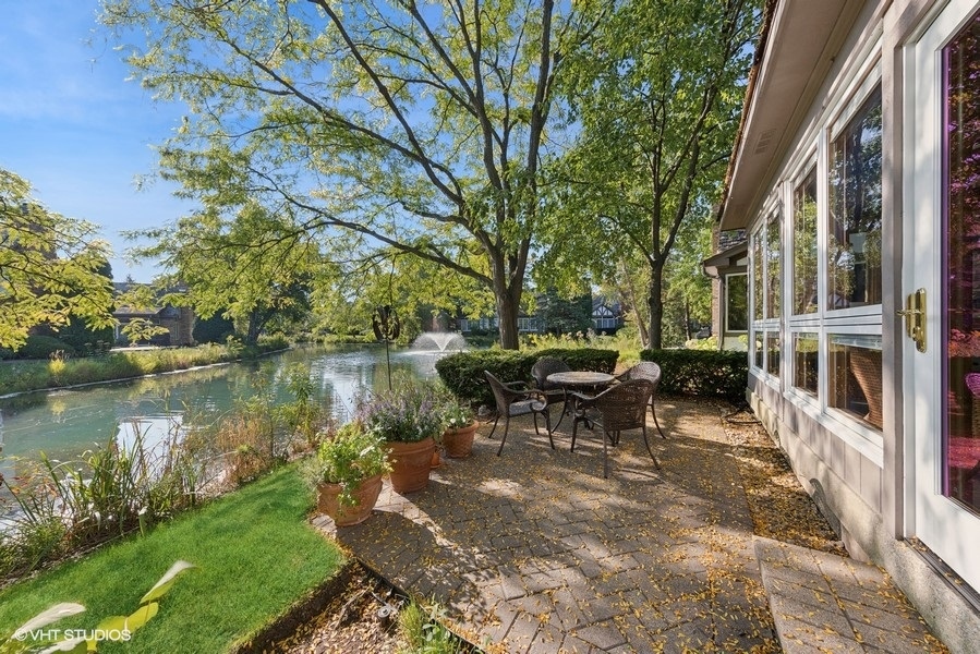 16 Lake Ridge Club Court Burr Ridge, IL 60527 - Photo 23 of 26 a view of a lake with outdoor seating