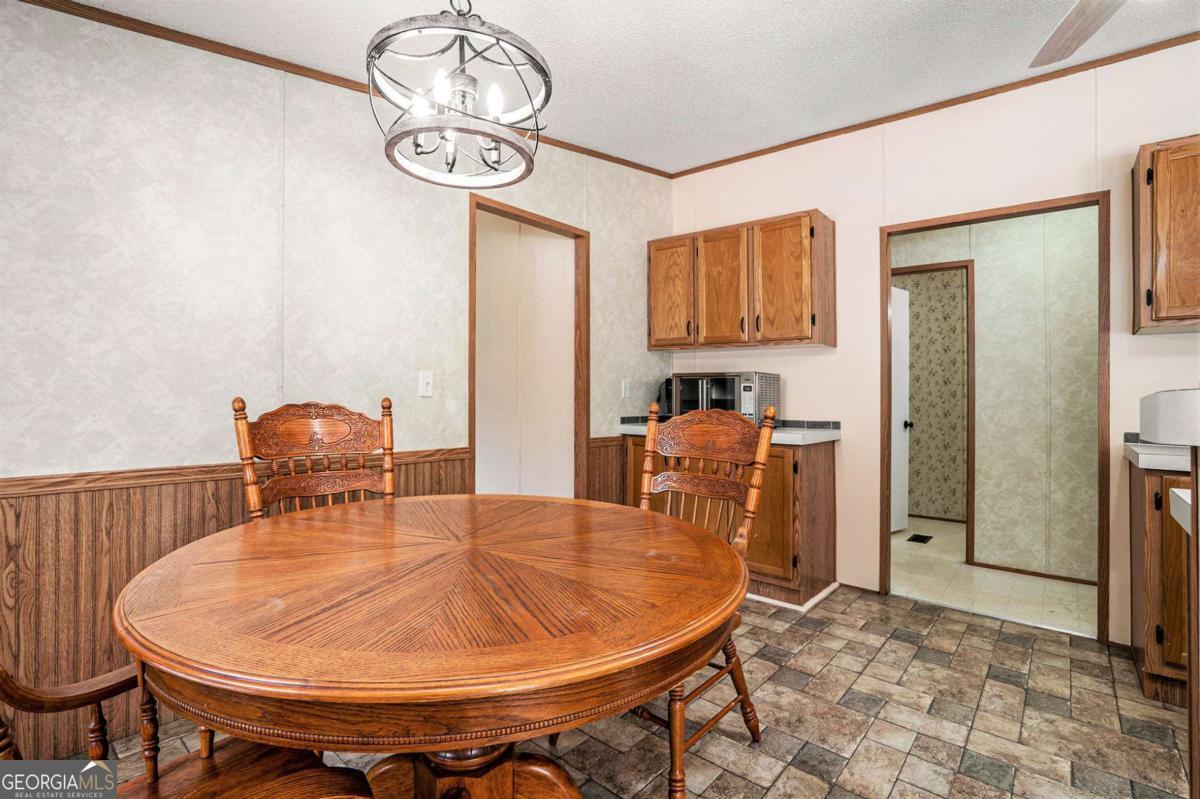 359 Norton Bridge Road Chatsworth, GA 30705 - Photo 15 of 28 a dining room with furniture and window