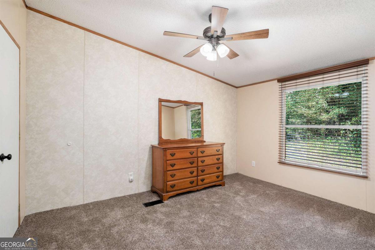 359 Norton Bridge Road Chatsworth, GA 30705 - Photo 16 of 28 a view of room with window and cabinet