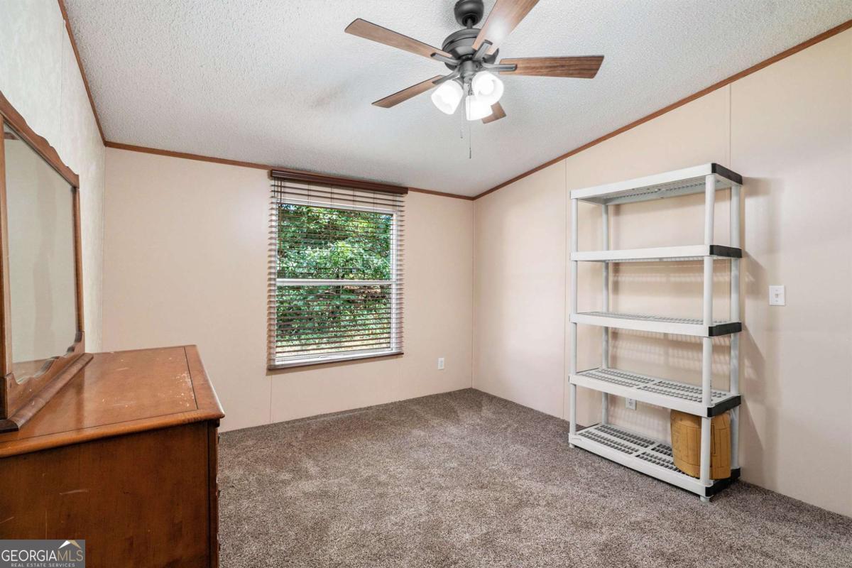 359 Norton Bridge Road Chatsworth, GA 30705 - Photo 17 of 28 a view of an empty room with a window