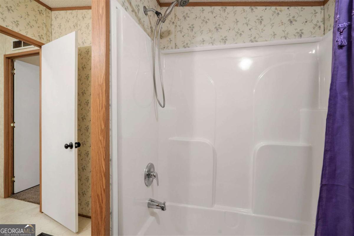 359 Norton Bridge Road Chatsworth, GA 30705 - Photo 20 of 28 a bathroom with a shower