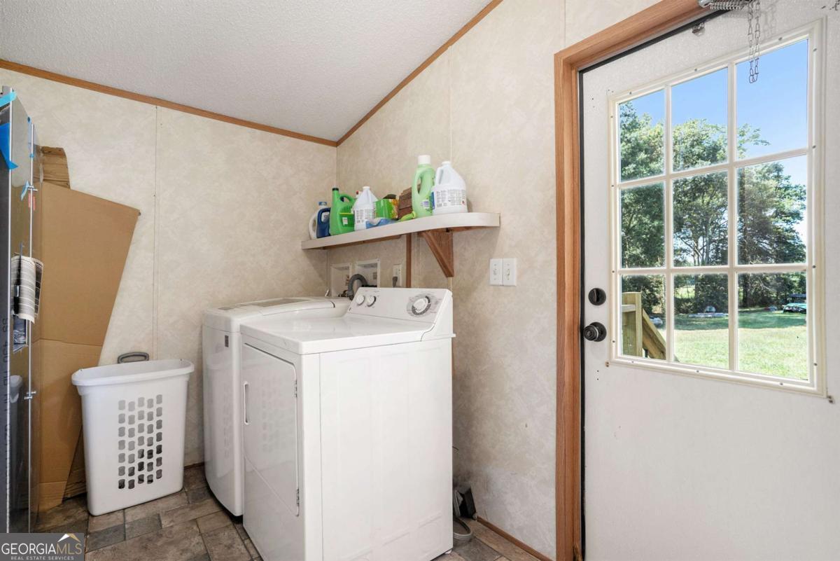 359 Norton Bridge Road Chatsworth, GA 30705 - Photo 21 of 28 a utility room with dryer and washer