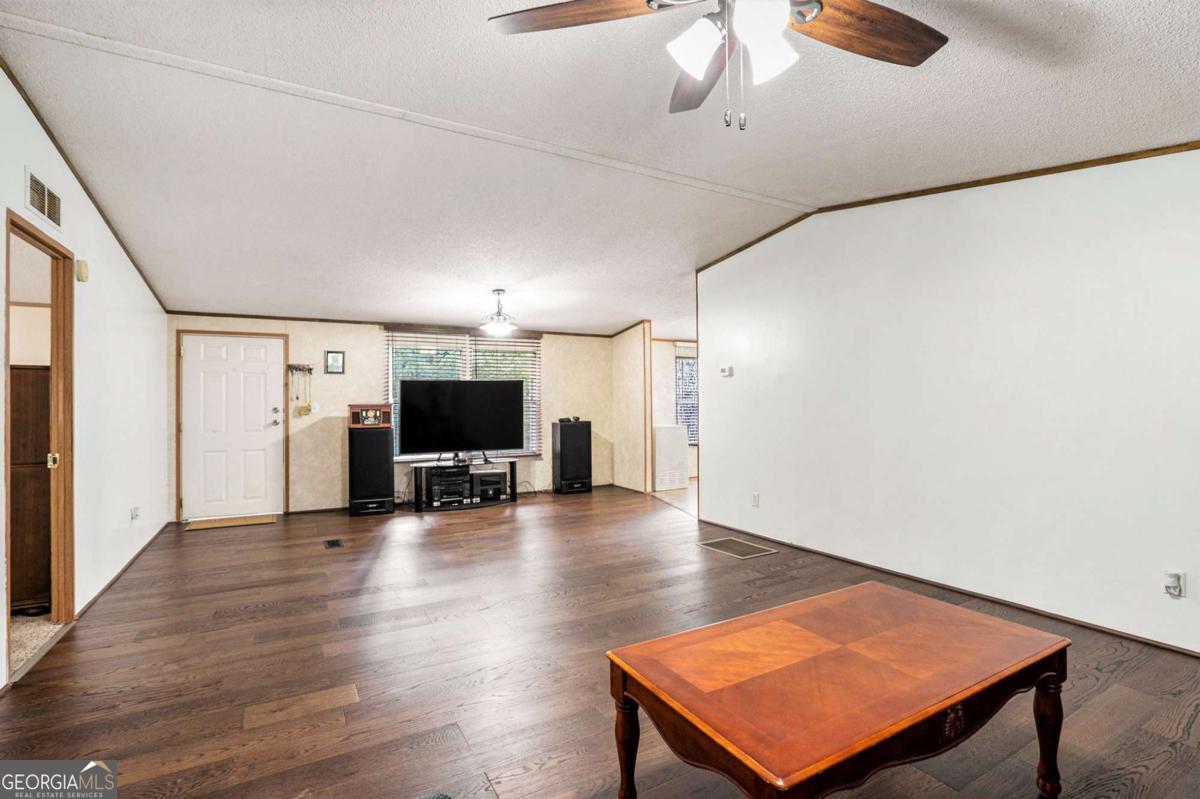 359 Norton Bridge Road Chatsworth, GA 30705 - Photo 23 of 28 a view of a room with wooden floor