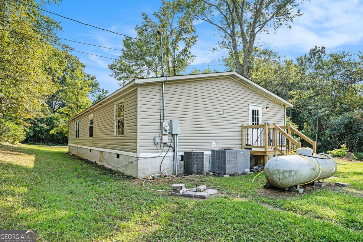 359 Norton Bridge Road Chatsworth, GA 30705 - Photo 27 of 28 a view of a house with backyard