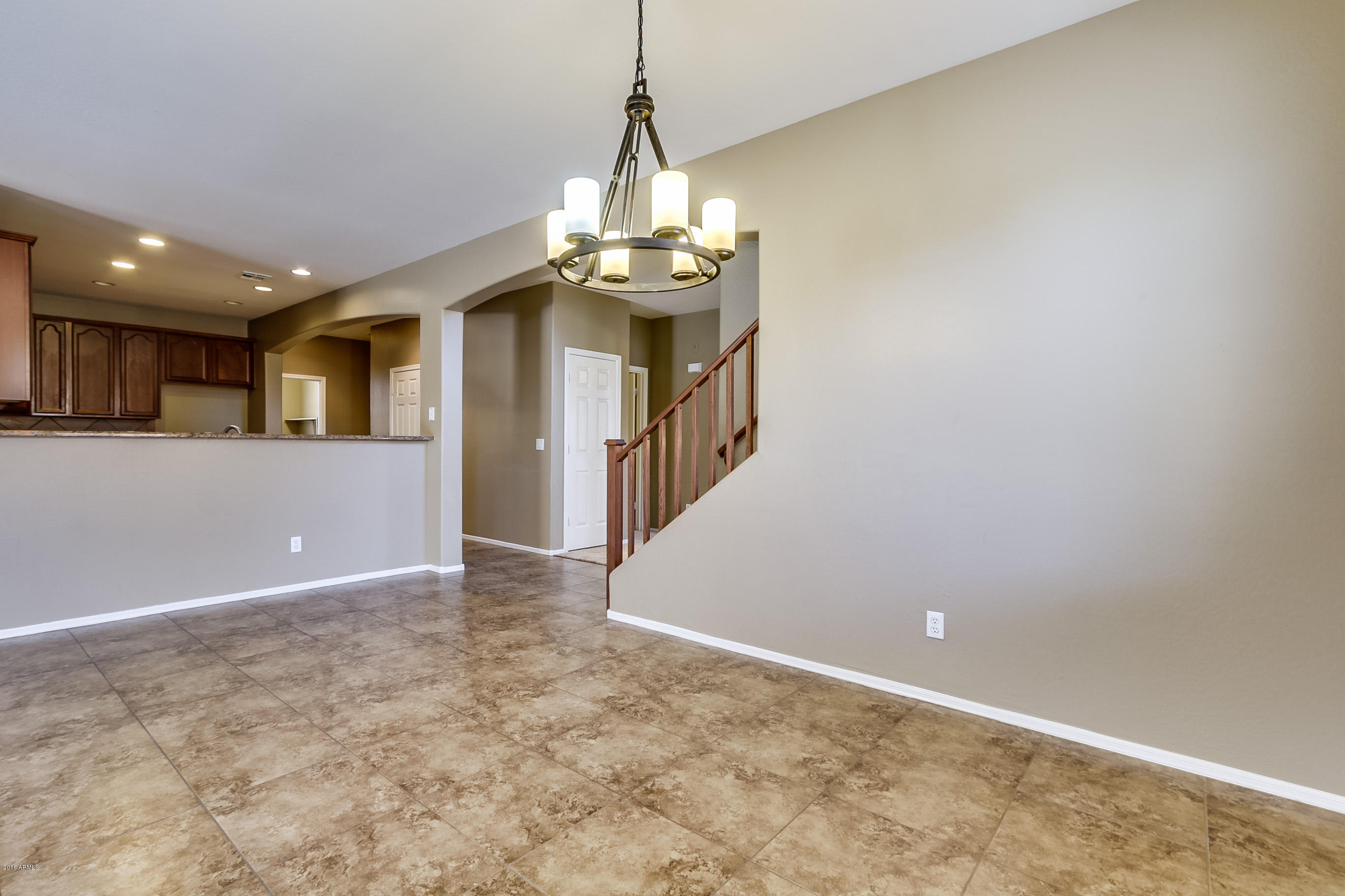 6829 West Carson Road Laveen, AZ 85339 - Photo 10 of 47 a view of a livingroom with a chandelier