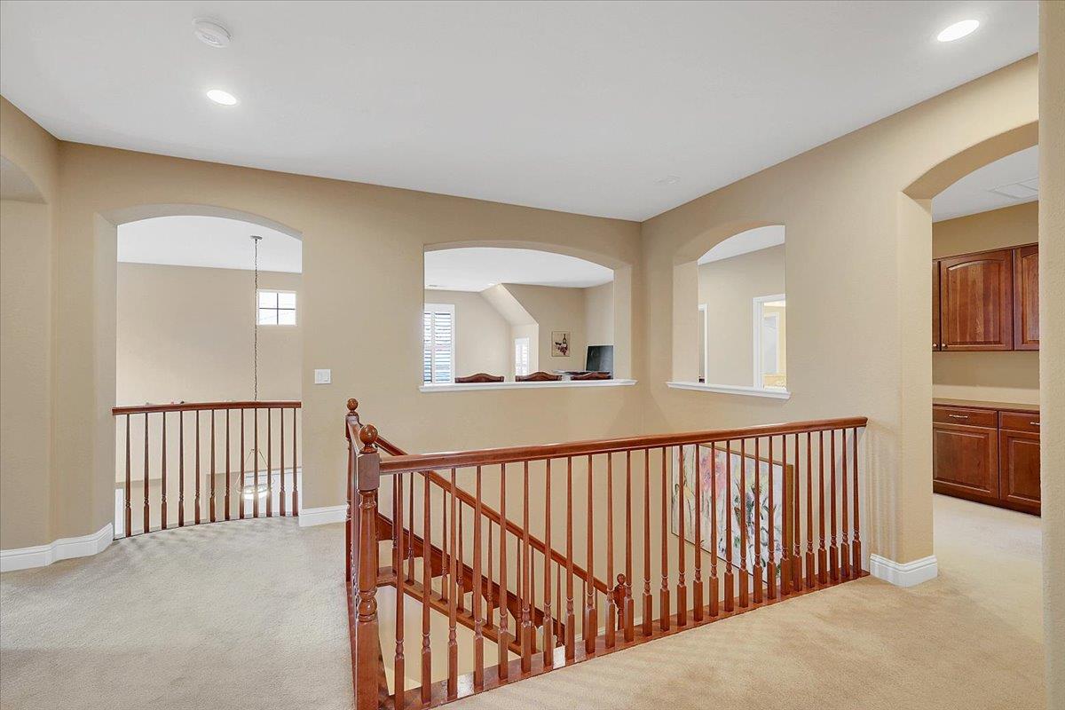 10022 Spring View Way Elk Grove, CA 95757 - Photo 34 of 54 a view of a hallway with bedroom and windows