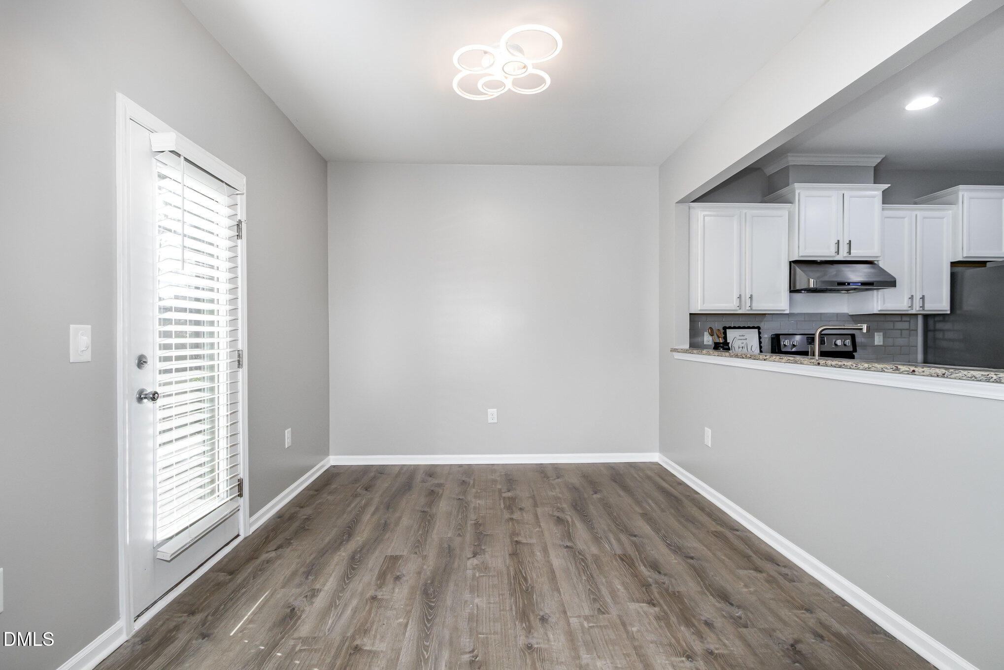 501 Brier Crossings Loop Durham, NC 27703 - Photo 9 of 31 a view of kitchen with wooden floor and electronic appliances