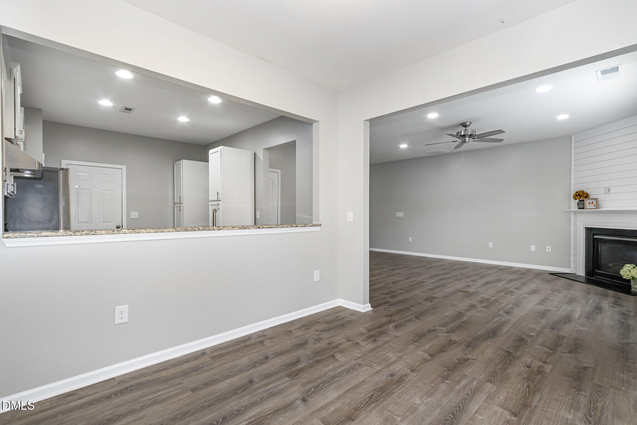 501 Brier Crossings Loop Durham, NC 27703 - Photo 10 of 31 an empty room with wooden floor and windows