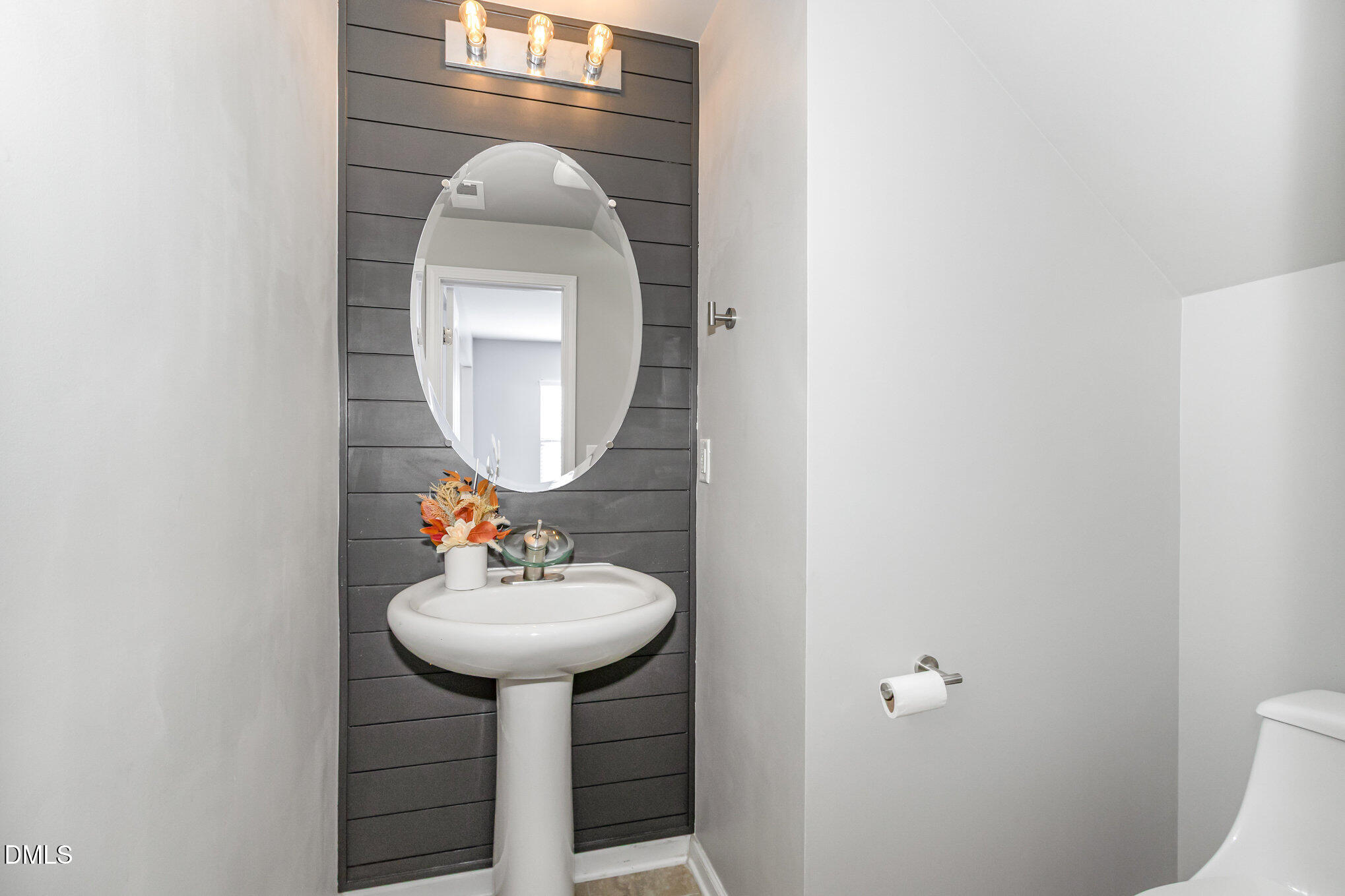 501 Brier Crossings Loop Durham, NC 27703 - Photo 14 of 31 a bathroom with a sink and a mirror