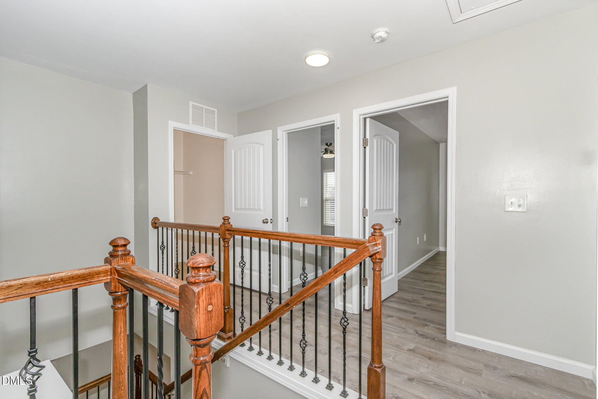 501 Brier Crossings Loop Durham, NC 27703 - Photo 15 of 31 a view of staircase with railing and white walls