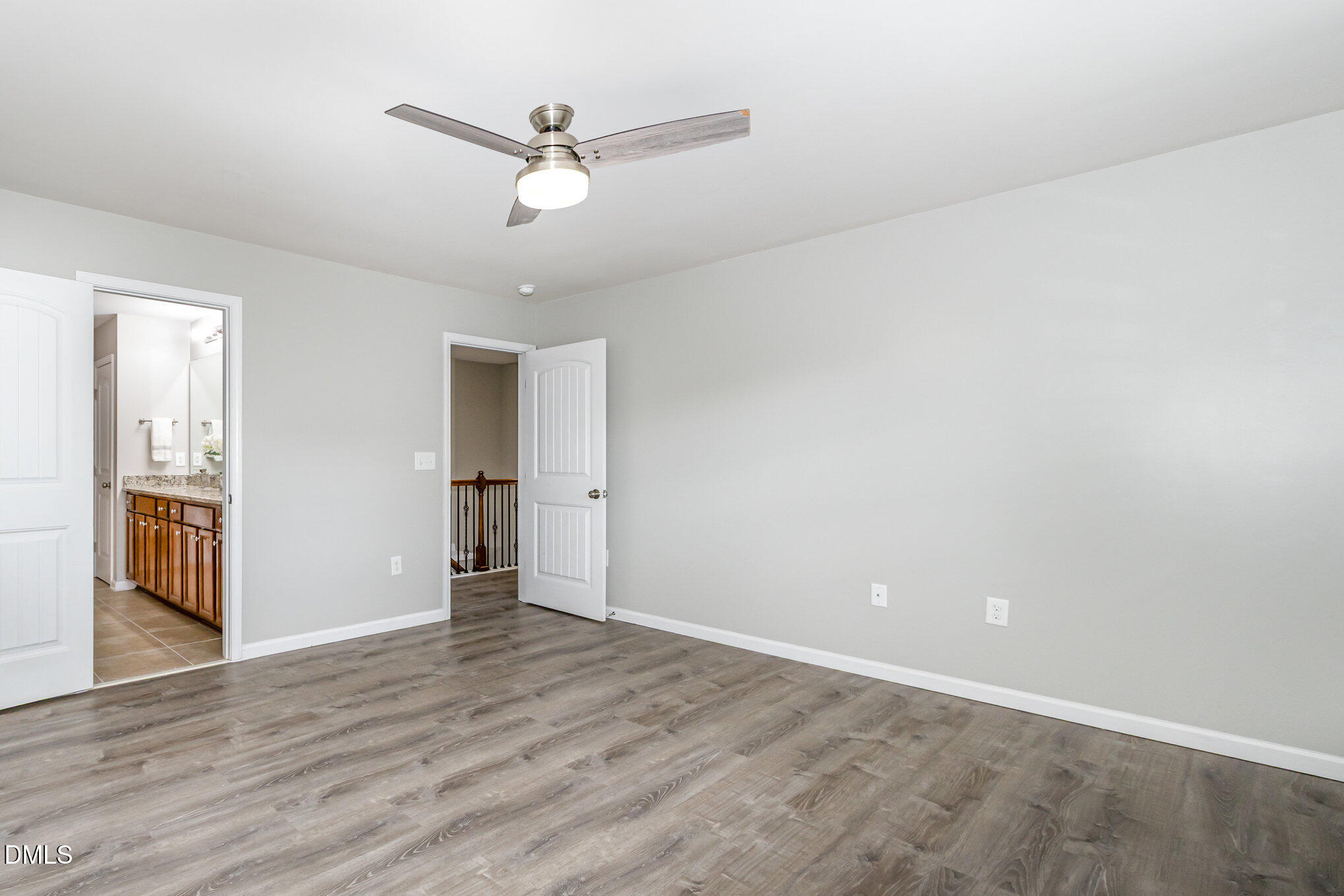 501 Brier Crossings Loop Durham, NC 27703 - Photo 17 of 31 a view of an empty room with wooden floor